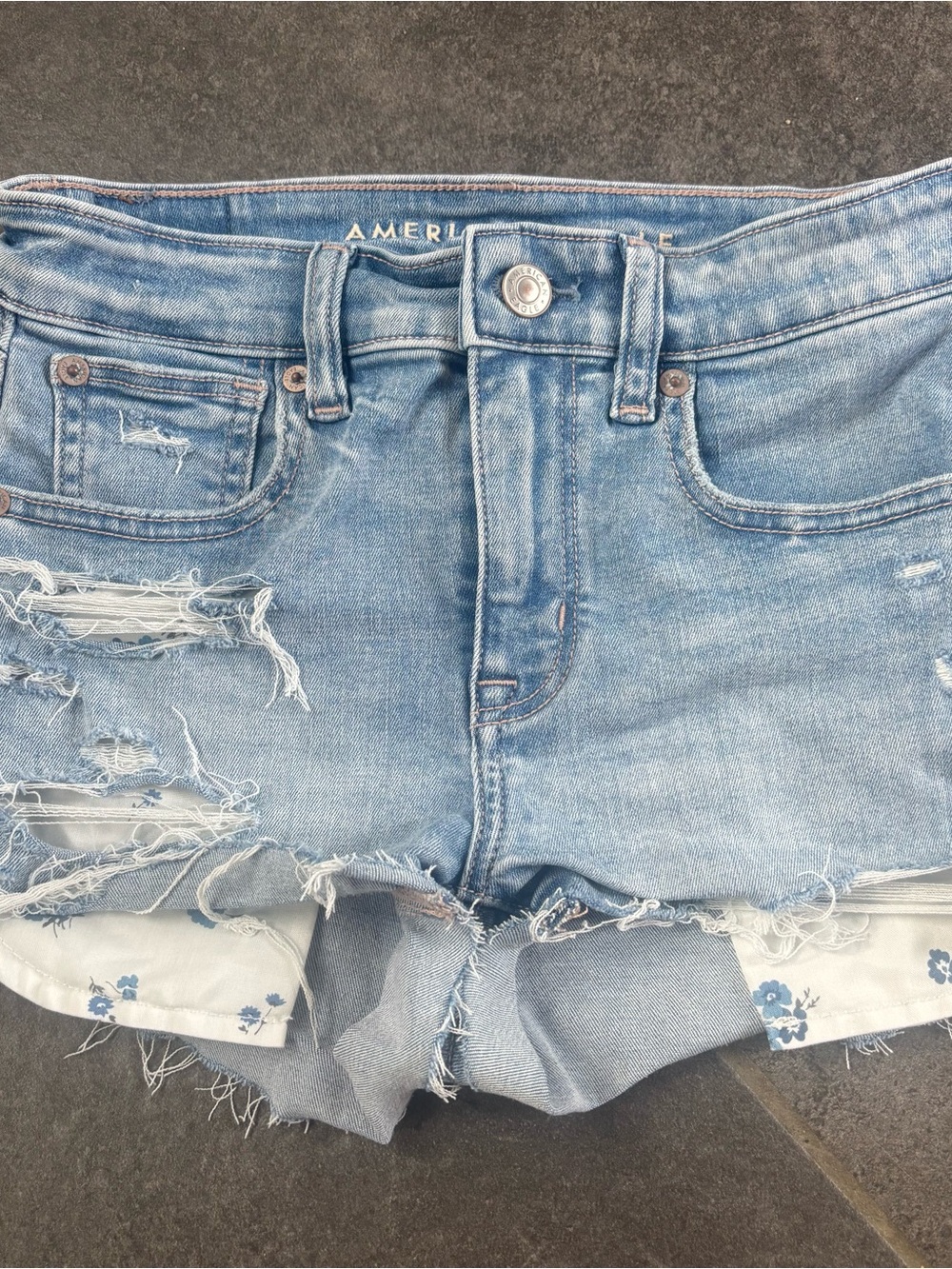 American Eagle Next Level Stretch Light Blue Distressed Denim Shorts 00 floral